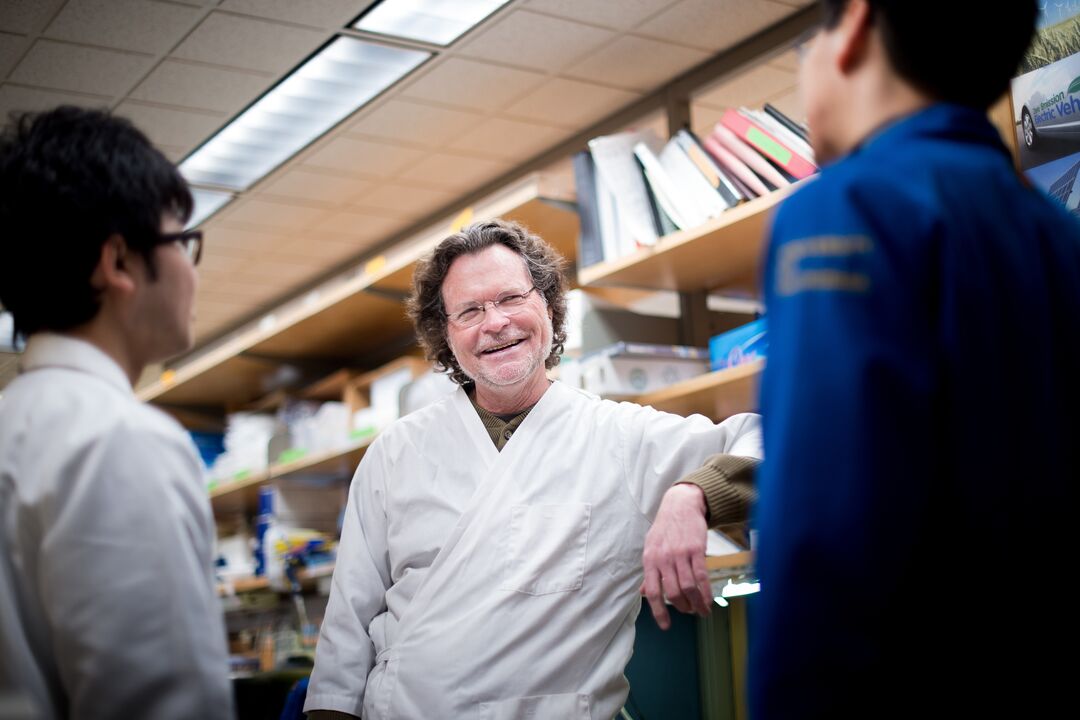 Dr. Lewis Lanier speaks with researchers in his lab in 2016. Photo by Noah Berger.