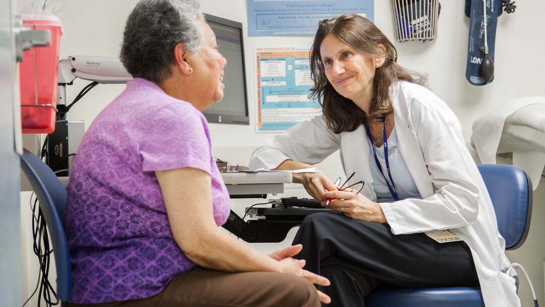 Alicia Fernandez, MD, meets with her long-time patient Ana Luianes at San Francisco General Hospital and Trauma Center (2015). Photo by Susan Merrell.