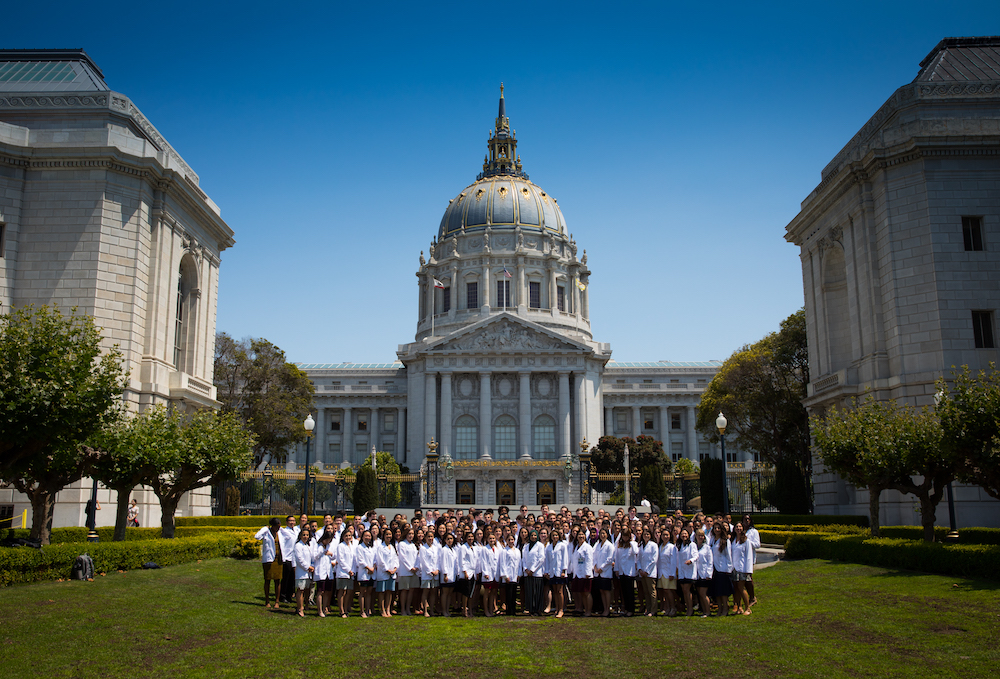 students stand in front of San Francisco City Hall