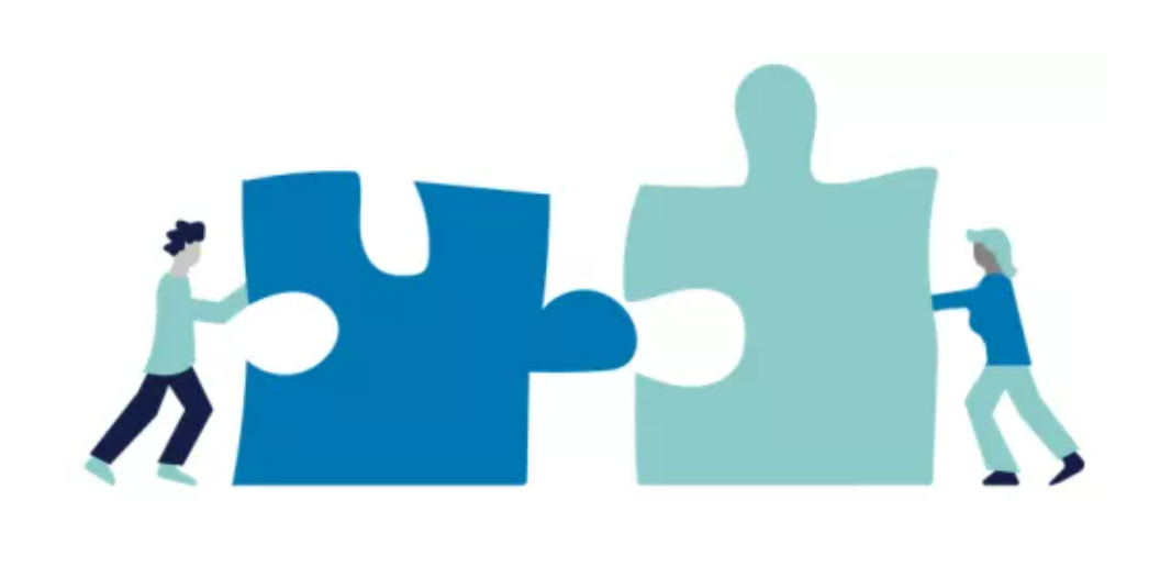 cartoon of two people pushing puzzle pieces together
